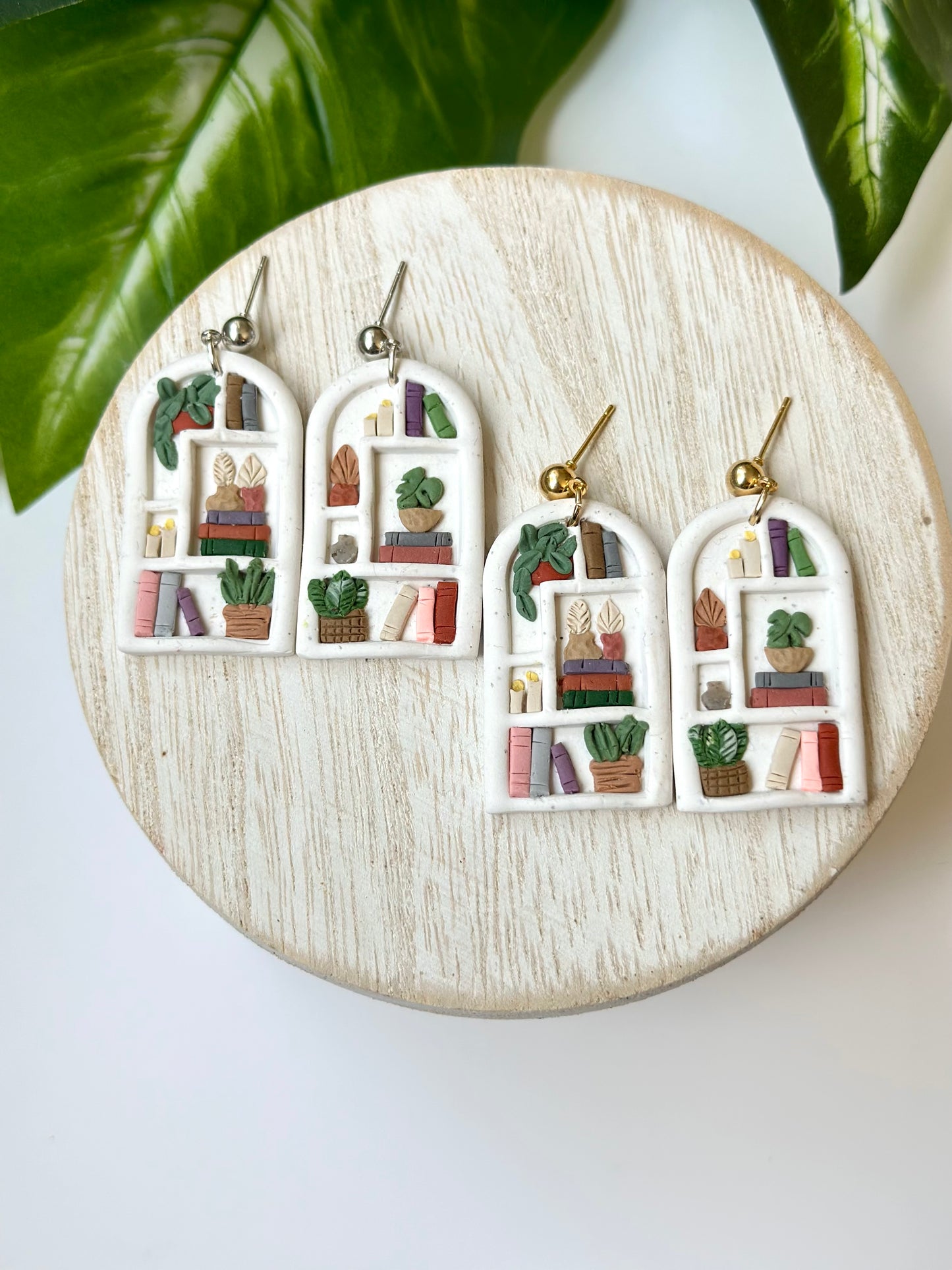 white stone bookshelf arches