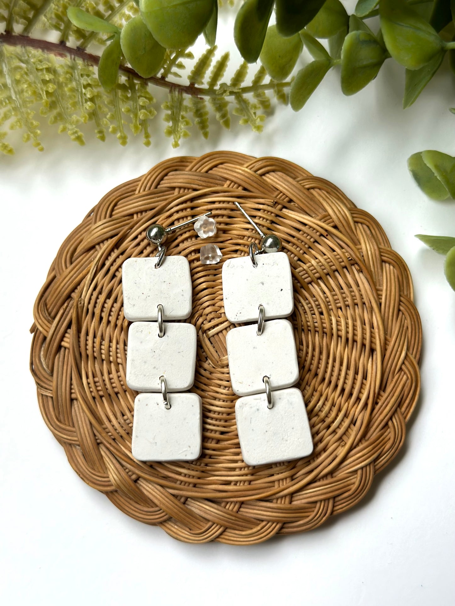 white stone bookshelf dangles