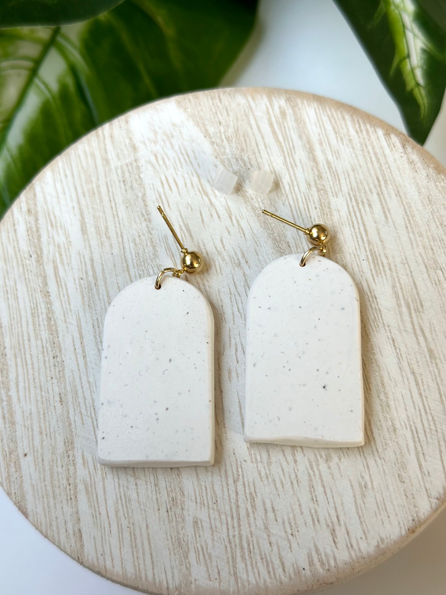 white stone bookshelf arches