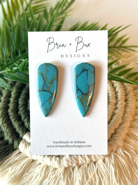 dagger studs in faux turquoise gloss